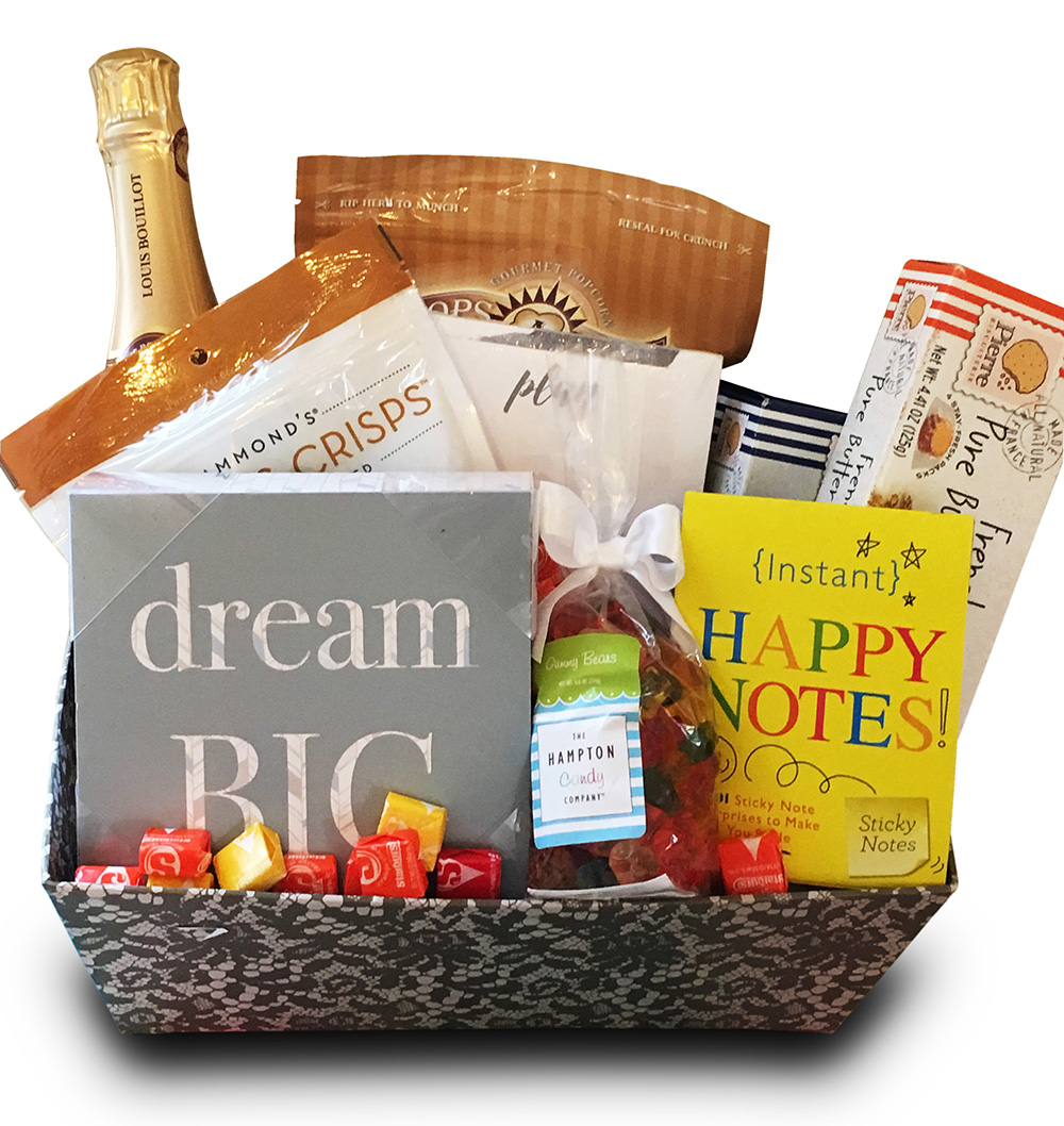 Gourmet gift basket with champagne and a dream big sign
