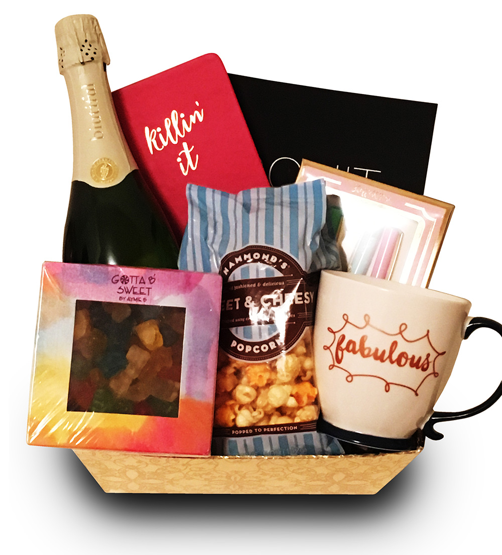 A custom Diana Delivers gift basket with sparkling wine, popcorn, and a fabulous mug