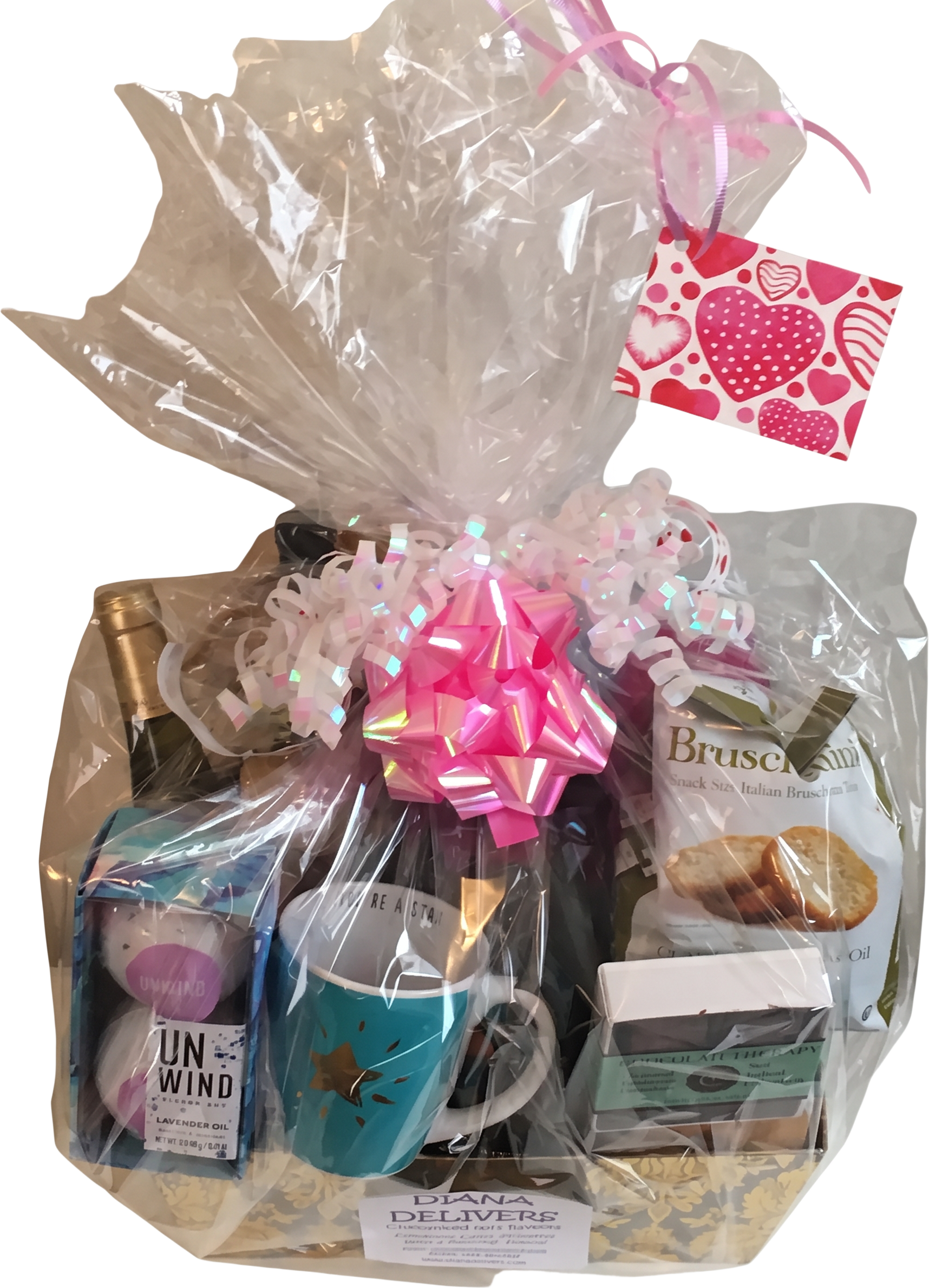 Gift basket with wine, chocolate, a star mug, and a heart gift tag
